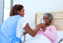 caregiver taking care of senior woman